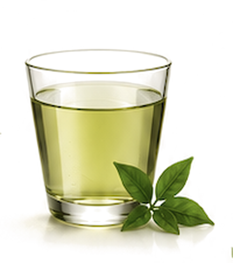 A glass of cold-brewed green tea with fresh tea leaves